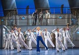 The ensemble on deck and dancing